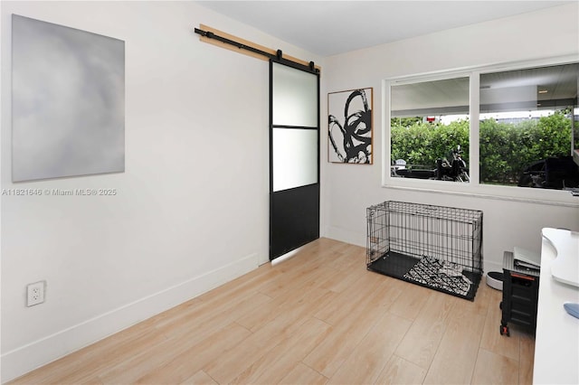 9627 SW 18th Ter, Miami, FL 33165 - entrance foyer with a barn door and wood finished floors