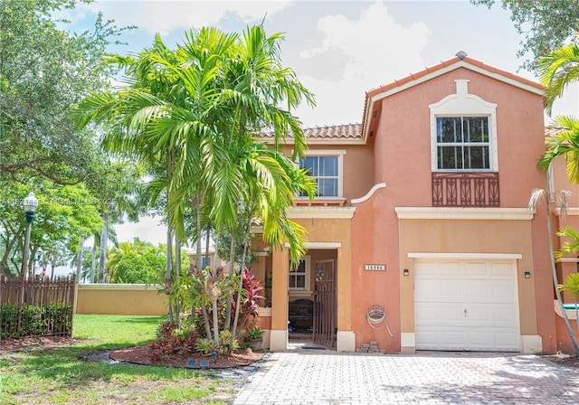 15285 SW 30th Ter, Miami, FL 33185 - view of front of home featuring a garage, stucco siding, a tiled roof, and driveway