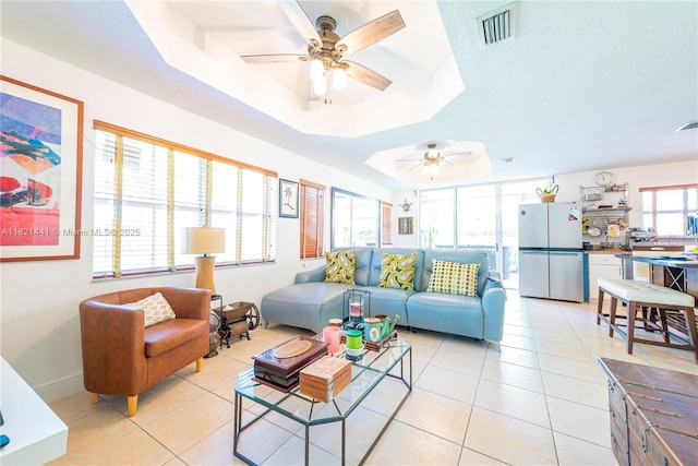 15285 SW 30th Ter, Miami, FL 33185 - living area with a raised ceiling, a ceiling fan, and light tile patterned floors