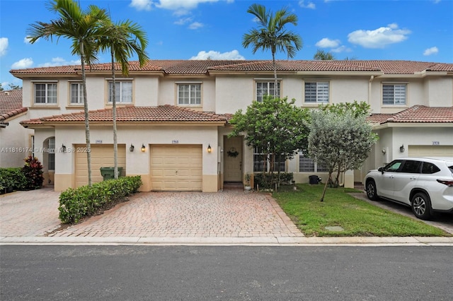 1968 NW 79th Way, Pembroke Pines, FL 33024 - view of front facade featuring stucco siding, driveway, a garage, a tiled roof, and a front lawn