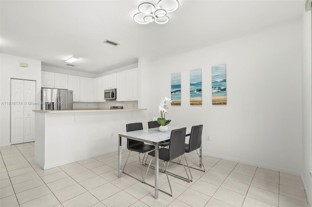 1968 NW 79th Way, Pembroke Pines, FL 33024 - dining area with light tile patterned floors and baseboards