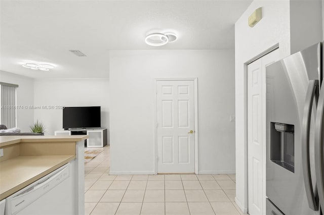 1968 NW 79th Way, Pembroke Pines, FL 33024 - kitchen with stainless steel fridge, white dishwasher, light tile patterned floors, open floor plan, and light countertops