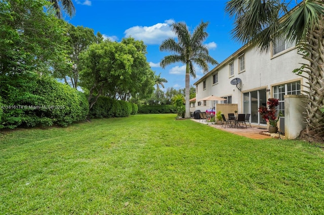 1968 NW 79th Way, Pembroke Pines, FL 33024 - view of grassy yard with a patio