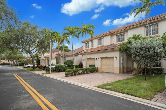 1968 NW 79th Way, Pembroke Pines, FL 33024 - multi unit property featuring stucco siding, a garage, a tile roof, and decorative driveway