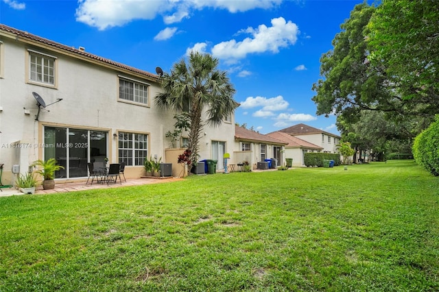 1968 NW 79th Way, Pembroke Pines, FL 33024 - rear view of property featuring stucco siding, a patio, and a lawn