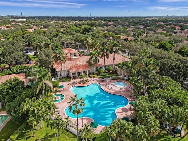 1968 NW 79th Way, Pembroke Pines, FL 33024 - aerial view of property and surrounding area featuring a pool area and a tree filled landscape
