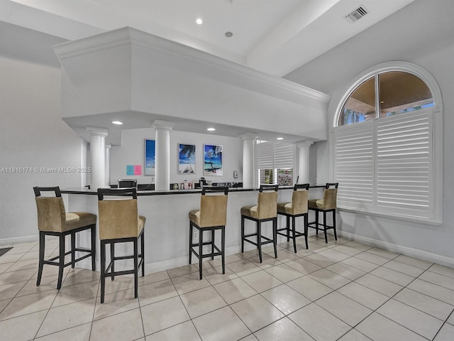1968 NW 79th Way, Pembroke Pines, FL 33024 - kitchen featuring decorative columns, light tile patterned flooring, a kitchen breakfast bar, and recessed lighting