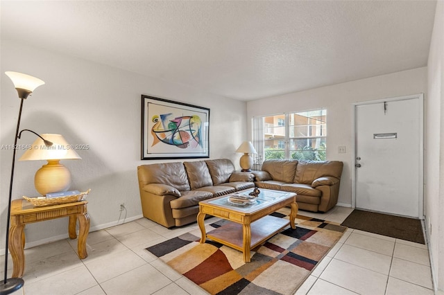 200 Croton Ave Unit 102, Lantana, FL 33462 - living room featuring a textured ceiling and light tile patterned floors
