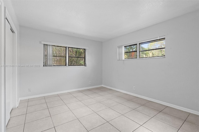 200 Croton Ave Unit 102, Lantana, FL 33462 - empty room featuring light tile patterned floors and baseboards