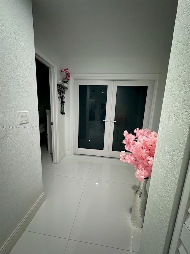 6315 SW 138th Ct Unit 6315-4, Miami, FL 33183 - hall with tile patterned floors, french doors, and a textured wall