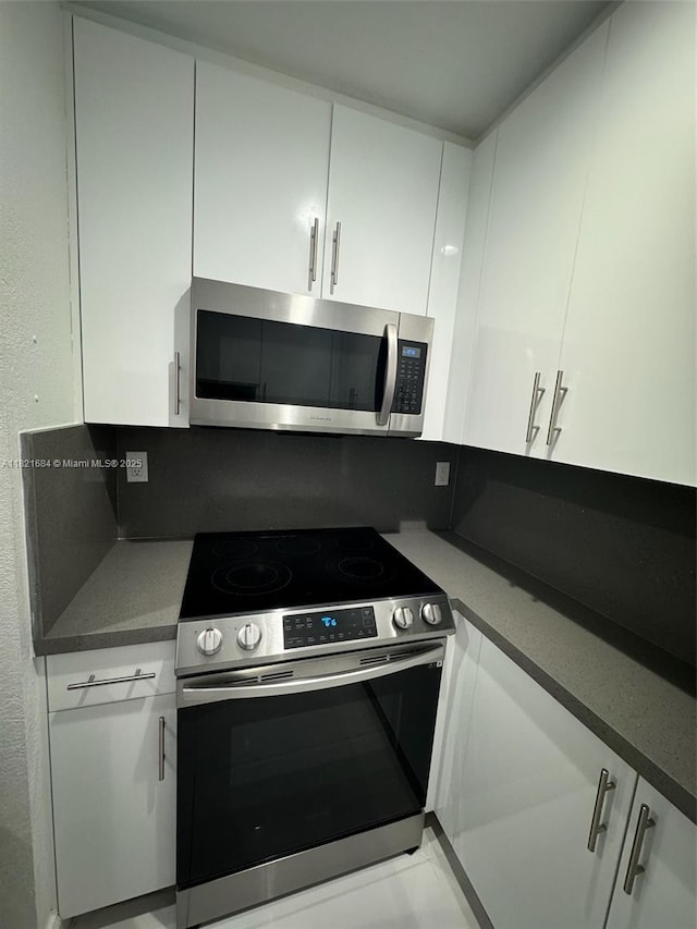 6315 SW 138th Ct Unit 6315-4, Miami, FL 33183 - kitchen featuring stainless steel appliances and white cabinetry