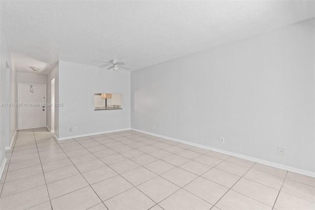 220 Croton Ave Unit 102, Lantana, FL 33462 - spare room featuring a ceiling fan, a textured ceiling, and light tile patterned flooring