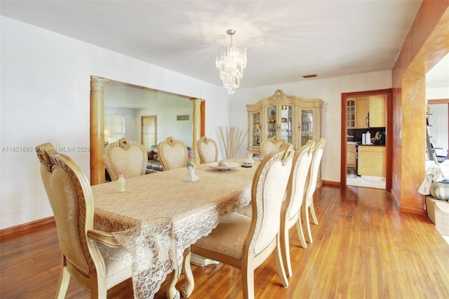 5959 SW 16th Ter, West Miami, FL 33155 - dining area featuring a chandelier and light wood-type flooring