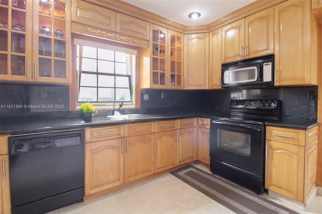 5959 SW 16th Ter, West Miami, FL 33155 - kitchen featuring black appliances, dark countertops, and tasteful backsplash
