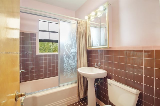 5959 SW 16th Ter, West Miami, FL 33155 - bathroom featuring tile walls and combined bath / shower with glass door