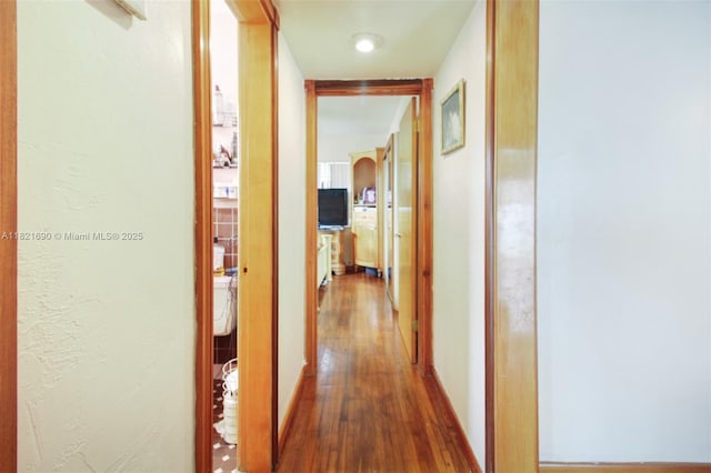 5959 SW 16th Ter, West Miami, FL 33155 - hallway with wood finished floors and arched walkways