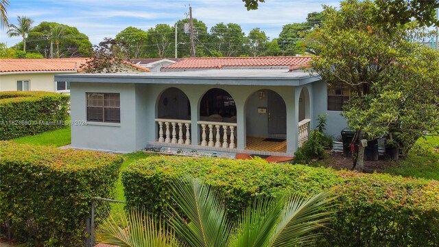 5959 SW 16th Ter, West Miami, FL 33155 - view of front of home featuring a porch and stucco siding