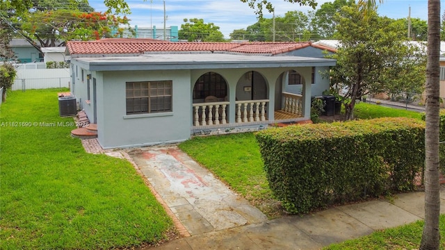 5959 SW 16th Ter, West Miami, FL 33155 - mediterranean / spanish house with a porch, stucco siding, and a tile roof
