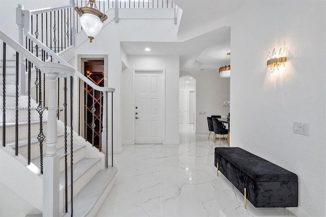1382 Harbor Vw W, Hollywood, FL 33019 - foyer with arched walkways, marble tiled floors, stairway, and recessed lighting