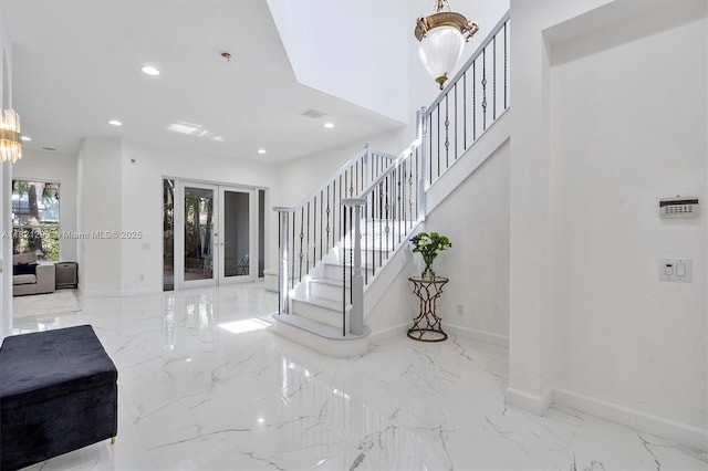 1382 Harbor Vw W, Hollywood, FL 33019 - foyer entrance with marble tiled floors, french doors, stairs, recessed lighting, and a chandelier