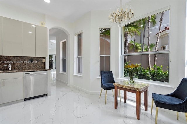 1382 Harbor Vw W, Hollywood, FL 33019 - kitchen with stainless steel dishwasher, arched walkways, plenty of natural light, decorative backsplash, and recessed lighting