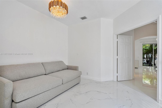 1382 Harbor Vw W, Hollywood, FL 33019 - living room with arched walkways, marble tiled floors, and a chandelier
