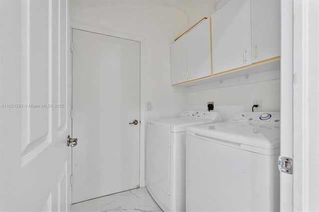 1382 Harbor Vw W, Hollywood, FL 33019 - washroom featuring cabinet space, washing machine and clothes dryer, and light marble finish flooring