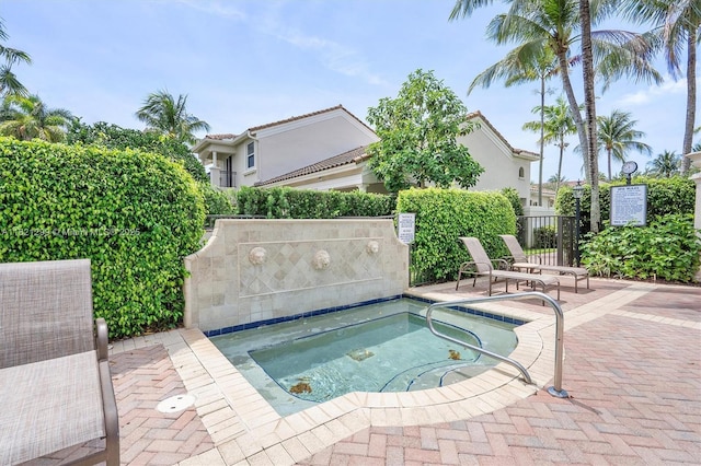 1382 Harbor Vw W, Hollywood, FL 33019 - view of pool featuring a community hot tub and a patio area