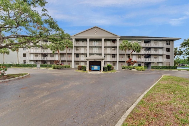 1520 Whitehall Dr Unit 103, Davie, FL 33324 - view of building exterior with uncovered parking