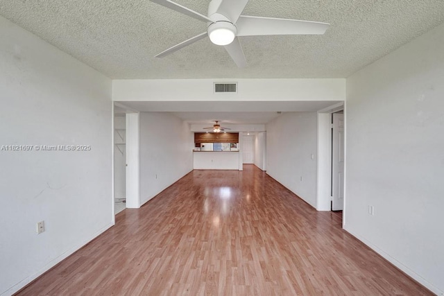 1520 Whitehall Dr Unit 103, Davie, FL 33324 - empty room featuring a ceiling fan, wood finished floors, and a textured ceiling