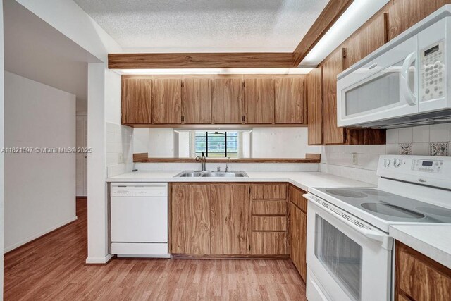 1520 Whitehall Dr Unit 103, Davie, FL 33324 - kitchen with white appliances, light countertops, decorative backsplash, and a textured ceiling