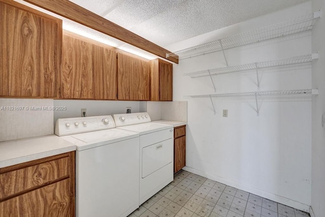 1520 Whitehall Dr Unit 103, Davie, FL 33324 - laundry room featuring light flooring, cabinet space, independent washer and dryer, and a textured ceiling