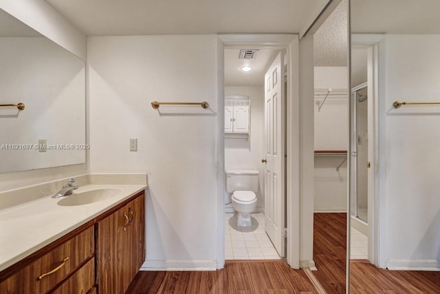 1520 Whitehall Dr Unit 103, Davie, FL 33324 - full bath featuring vanity, a spacious closet, and wood finished floors