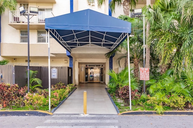 801 NW 47th Ave Unit 409W, Miami, FL 33126 - entrance to property with stucco siding and a carport