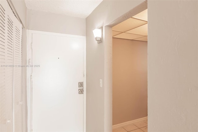801 NW 47th Ave Unit 409W, Miami, FL 33126 - hallway with light tile patterned floors and baseboards