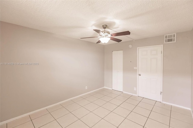 801 NW 47th Ave Unit 409W, Miami, FL 33126 - unfurnished room with ceiling fan, a textured ceiling, and light tile patterned floors