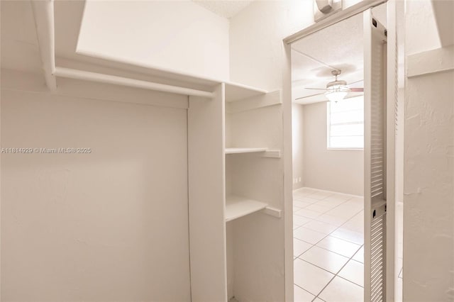 801 NW 47th Ave Unit 409W, Miami, FL 33126 - walk in closet with light tile patterned flooring and ceiling fan