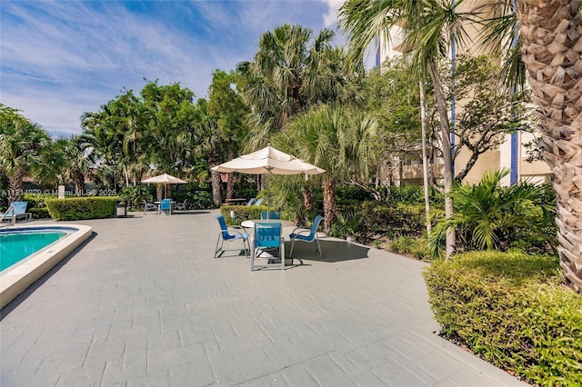 801 NW 47th Ave Unit 409W, Miami, FL 33126 - community pool with a patio area and outdoor dining area