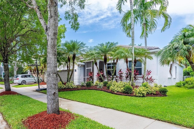 542 Penta Ct, Weston, FL 33327 - view of front of house featuring stucco siding, a front lawn, and driveway
