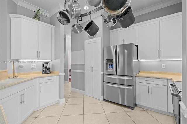 542 Penta Ct, Weston, FL 33327 - kitchen with stainless steel refrigerator with ice dispenser, white cabinetry, ornamental molding, light countertops, and light tile patterned floors
