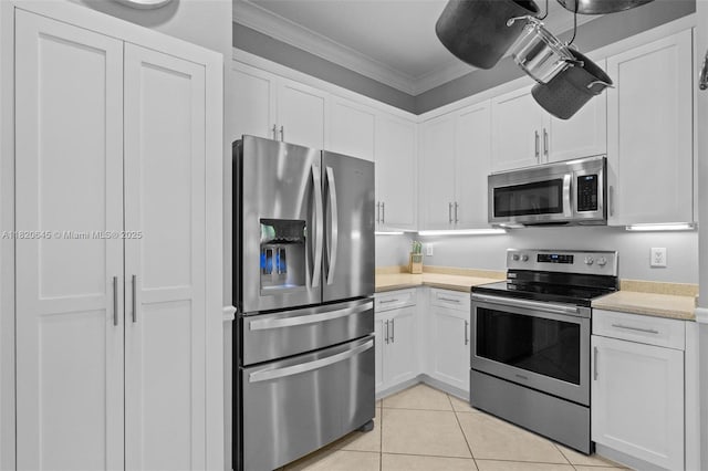 542 Penta Ct, Weston, FL 33327 - kitchen with appliances with stainless steel finishes, light countertops, ornamental molding, and white cabinetry