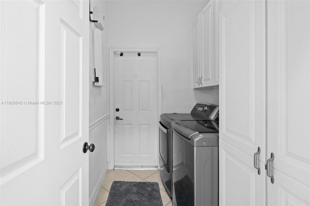 542 Penta Ct, Weston, FL 33327 - laundry area with washing machine and dryer, cabinet space, and light tile patterned floors