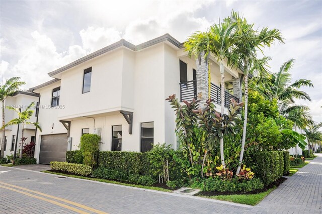 8217 NW 46th St, Doral, FL 33166 - townhome / multi-family property with a garage and stucco siding