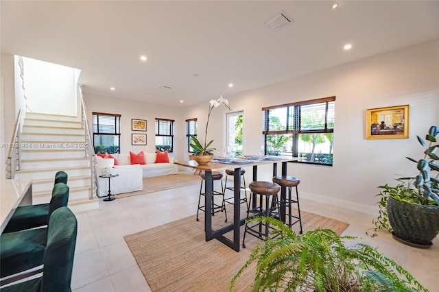 8217 NW 46th St, Doral, FL 33166 - dining area with recessed lighting, light tile patterned floors, and stairs