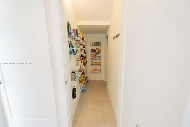 8217 NW 46th St, Doral, FL 33166 - hall with light tile patterned flooring and baseboards