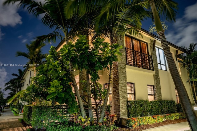 8217 NW 46th St, Doral, FL 33166 - view of side of home with stucco siding and a balcony
