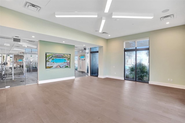 8217 NW 46th St, Doral, FL 33166 - unfurnished living room featuring wood finished floors and baseboards