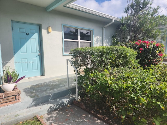 1239 Marseille Dr Unit 4, Miami Beach, FL 33141 - doorway to property featuring stucco siding