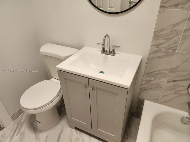 1239 Marseille Dr Unit 4, Miami Beach, FL 33141 - bathroom with marble finish floors, a tub, and vanity