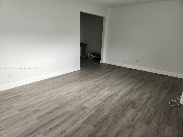 1239 Marseille Dr Unit 4, Miami Beach, FL 33141 - unfurnished room featuring dark wood-type flooring